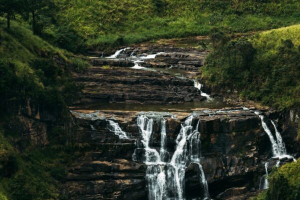 Waterfall among the green mountains. Waterfalls Of Sri Lanka. Landscapes Of Asia